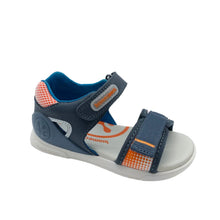 Load image into Gallery viewer, A single children's sandal by Birraio, featuring navy blue straps, a blue interior lining, and orange patterned accents on the heel and side strap, set against a plain light gray background.