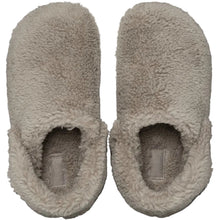 Load image into Gallery viewer, A pair of plush, fuzzy slip-on slippers in a light taupe-beige color, shown from a top-down view against a solid black background.