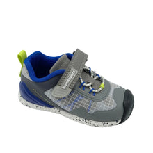 Load image into Gallery viewer, A toddler's gray and blue athletic shoe with a hook-and-loop strap, speckled white sole, and lime green accents, photographed on a white studio background.