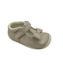 Load image into Gallery viewer, A single baby shoe in a light beige or champagne color, featuring a textured upper, a decorative bow on the toe, and a hook-and-loop strap closure, set against a plain white background.