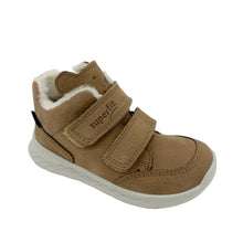 Load image into Gallery viewer, A toddler's mid-height winter sneaker in tan suede with a white faux-fur lining and two hook-and-loop straps, shown on a white background.