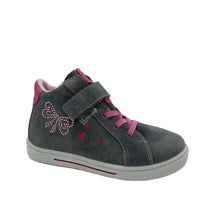 Load image into Gallery viewer, A pair of girls' ankle boots with a carbon color leather upper and pink accents, featuring a bow and diamond detail on the side, elasticated lace, and a single velcro strap.