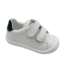 Load image into Gallery viewer, White children's shoe with navy accents on a light gray background