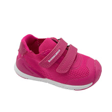 Load image into Gallery viewer, A bright pink child's trainer with breathable textile upper, leather insole, robust toe bumper, cushioned ankle area, and double velcro straps.