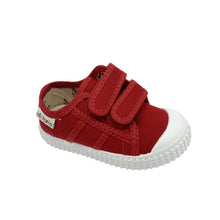 Load image into Gallery viewer, A red and white Victoria Junior canvas shoe with double velcro fastenings and a rubber toe bumper.