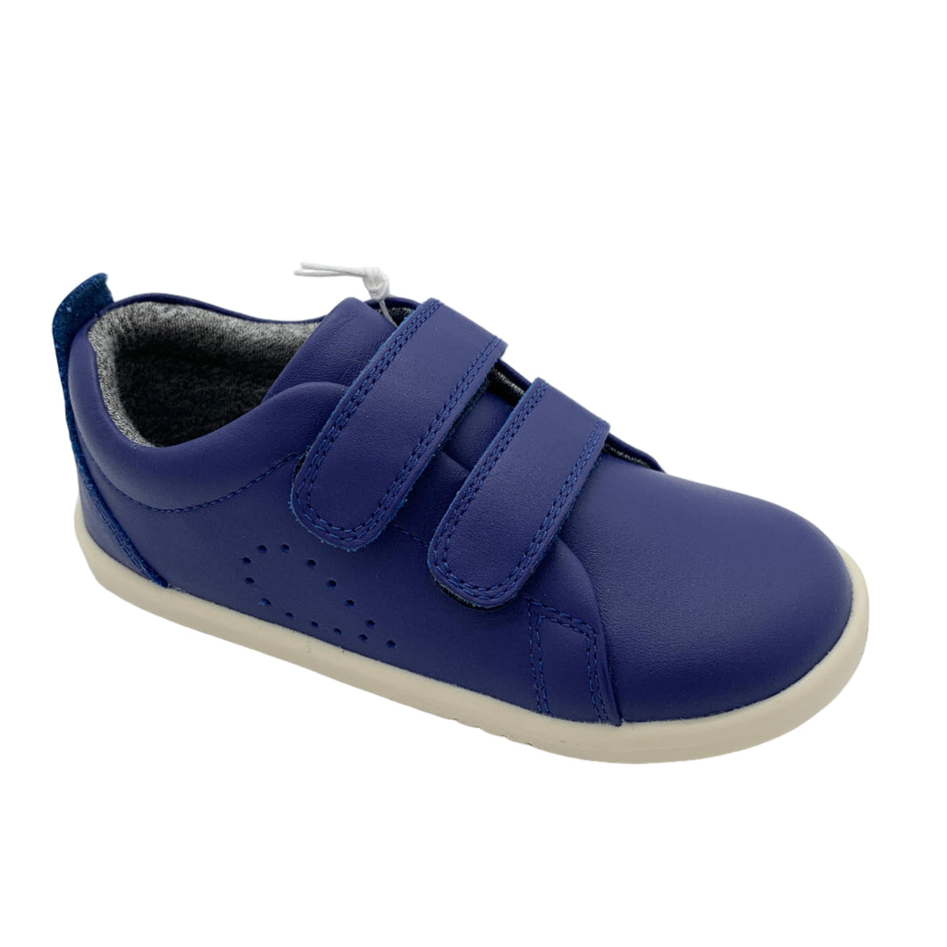 Blue children's shoe with velcro straps on a white background