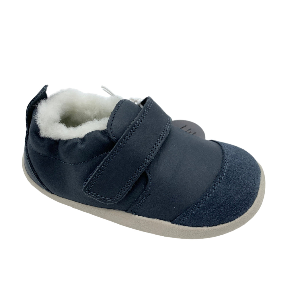 Navy blue children's shoe with white fur lining on a white background