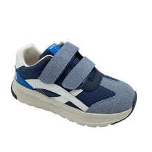 Load image into Gallery viewer, A navy blue and slate blue toddler sneaker with two hook-and-loop straps, a white side stripe, and a beige sole, photographed on a white studio background.
