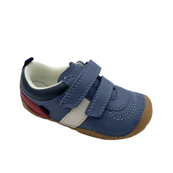 Blue children's shoe with velcro straps on a white background