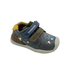 Load image into Gallery viewer, A toddler's grey slip-on shoe with a blue and brown hook-and-loop strap, decorated with cartoon dinosaur and mushroom graphics, on a white studio background.

