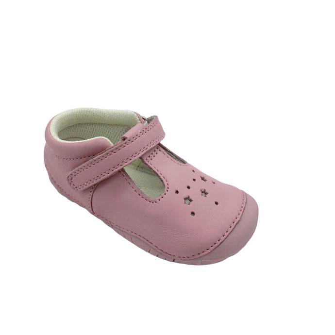 Pink children's shoe with a strap on a light gray background