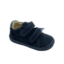 Load image into Gallery viewer, A single navy blue toddler shoe with two hook-and-loop straps and a beige interior lining, photographed on a light gray studio background.
