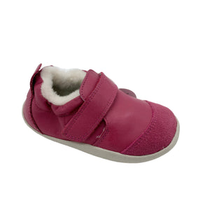 Pink children's shoe with velcro closure on a white background