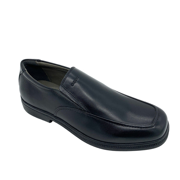 Black leather loafer shoe on a white background