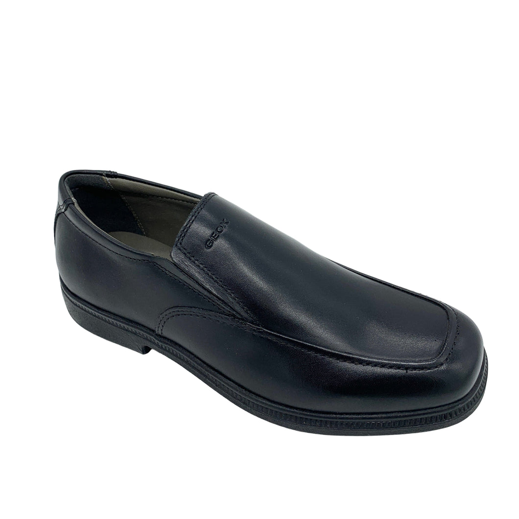 Black leather loafer shoe on a white background