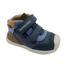 Load image into Gallery viewer, A navy blue toddler sneaker with hook-and-loop straps, a beige toe cap, and a brown heel counter, shown on a white background.
