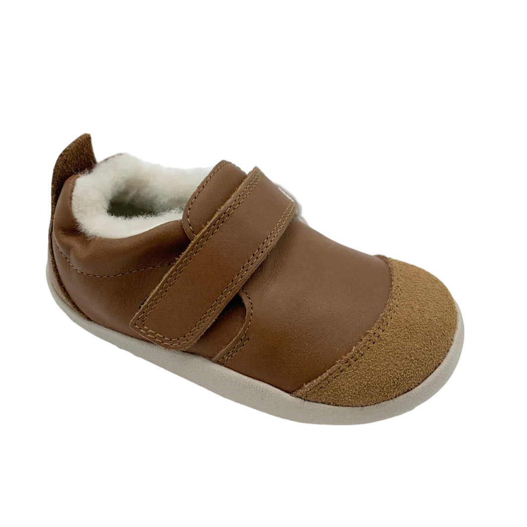 Brown children's shoe with a strap on a white background