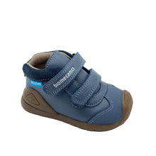 Load image into Gallery viewer, A single blue baby shoe with three hook-and-loop straps and a brown sole, photographed on a light gray background. The brand name 'bionicas' is visible on the strap.
